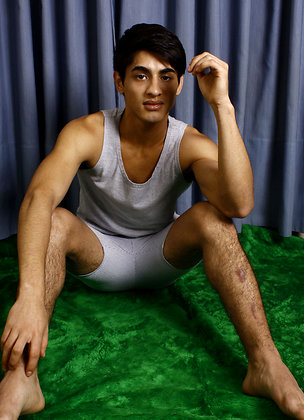 Good-looking twink posing at the studio